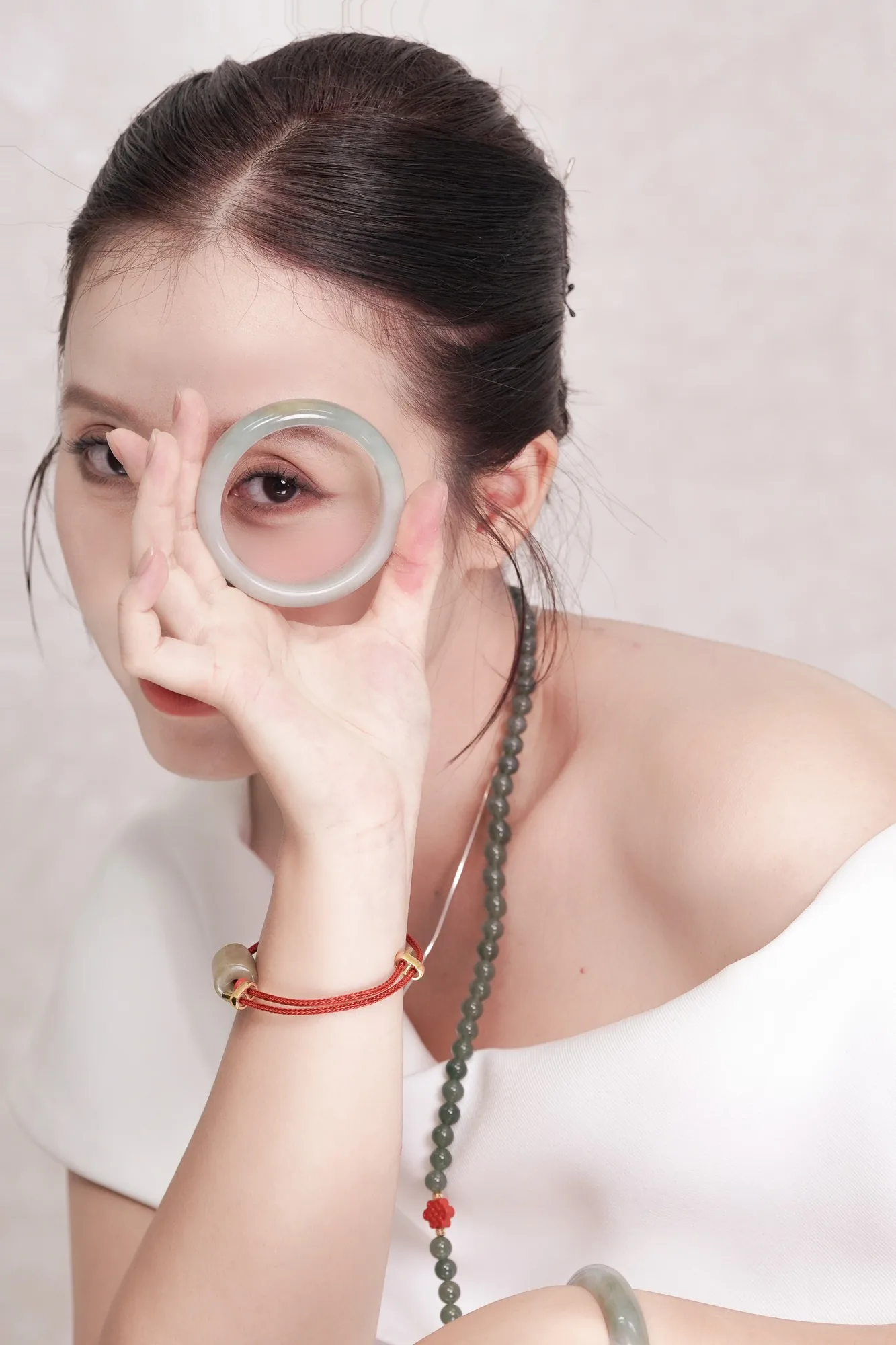 THỨC · Portrait against a pale backdrop